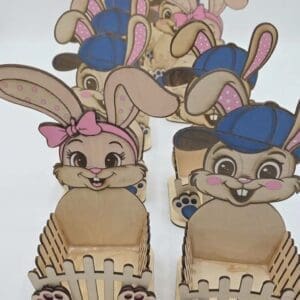 Wooden bunny-themed holders in a row.