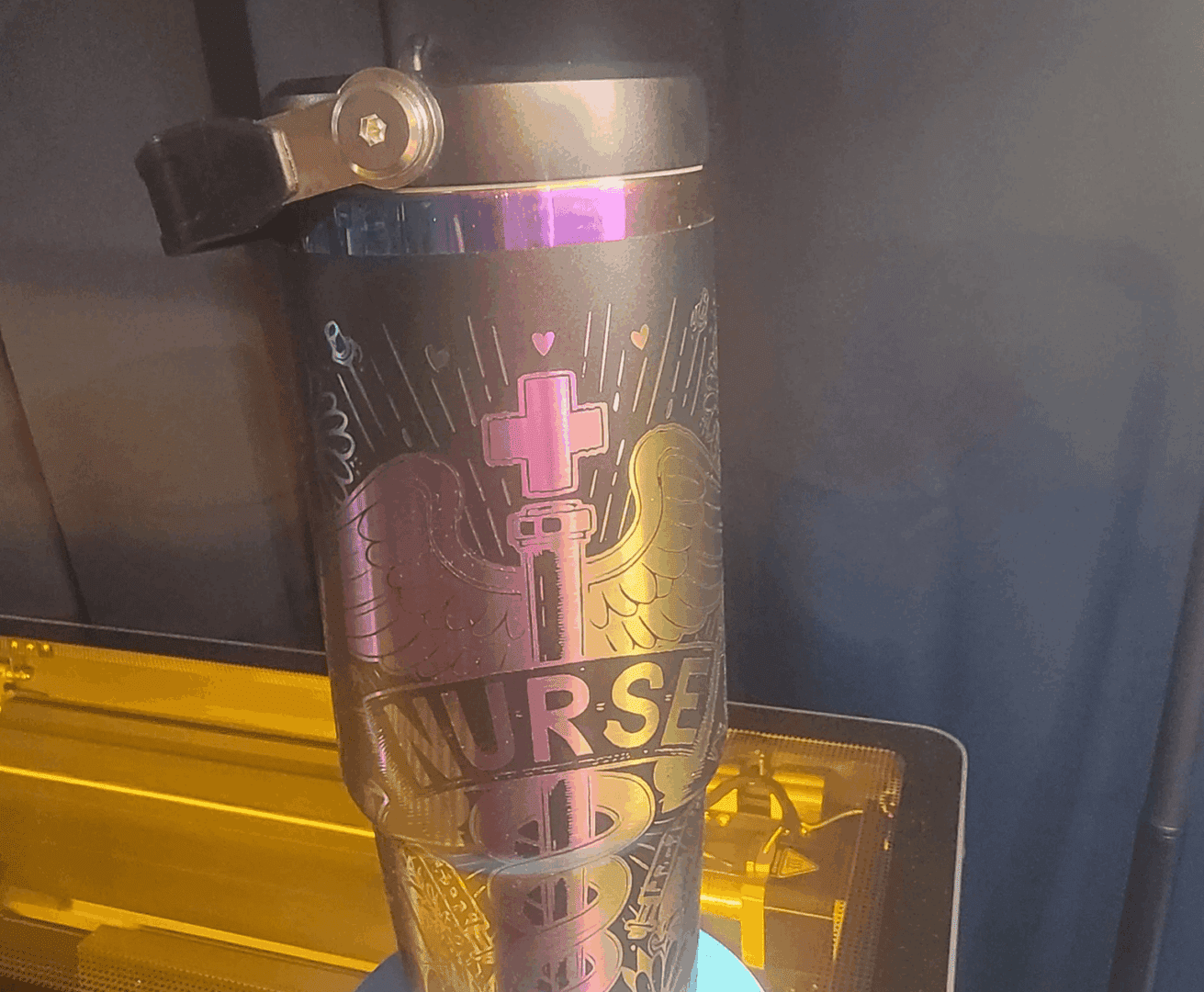 Black travel mug featuring medical symbols