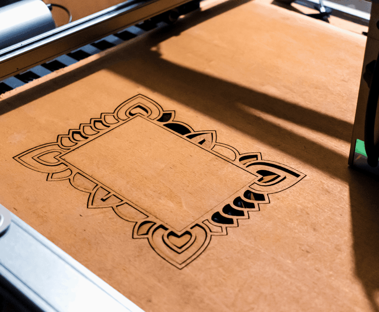 Laser-engraved decorative design on wood