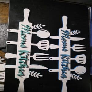 Decorative 'Mom's Kitchen' wall signs.
